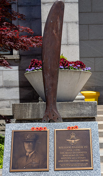 Photo of memorial to William Barker at Mount Pleasant Cemetery Toronto. SHows two memorial plaques and a propellor